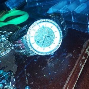 A ⌚ watch and eyelashes and necklaces and bracelet